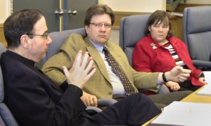 Arnold Drung and Anne Taylor listen as President Bugbee (l) adds to the discussion at a recent Board of Directors meeting.